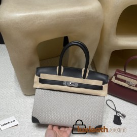 30cm Birkin (Fabric & Swift Leather) – Color: 89 Noir (with Silver Hardware) The fabric material creates a youthful vibe and is lighter than full-leather versions, which is its key feature.