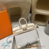 Hermès Birkin 25 (Triomphe H Canvas & Swift Leather) – Color: I2/Nata (with Silver Hardware) – A soft cream-white hue – This model is characterized by a combination of high-quality Swift leather and lightweight canvas. The natural cream-white color create