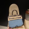 30cm Birkin (Swift Leather & Denim Canvas) – Color: 46/Ebene with Gold Hardware The perfect combination of Swift leather and canvas creates a profound vintage mood – a rare item with excellent investment potential.